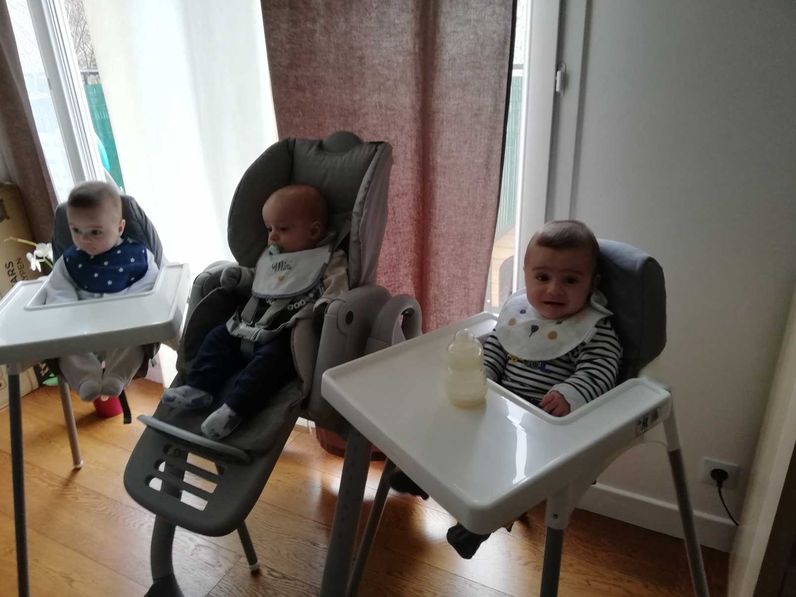 Babies sitting in the chairs