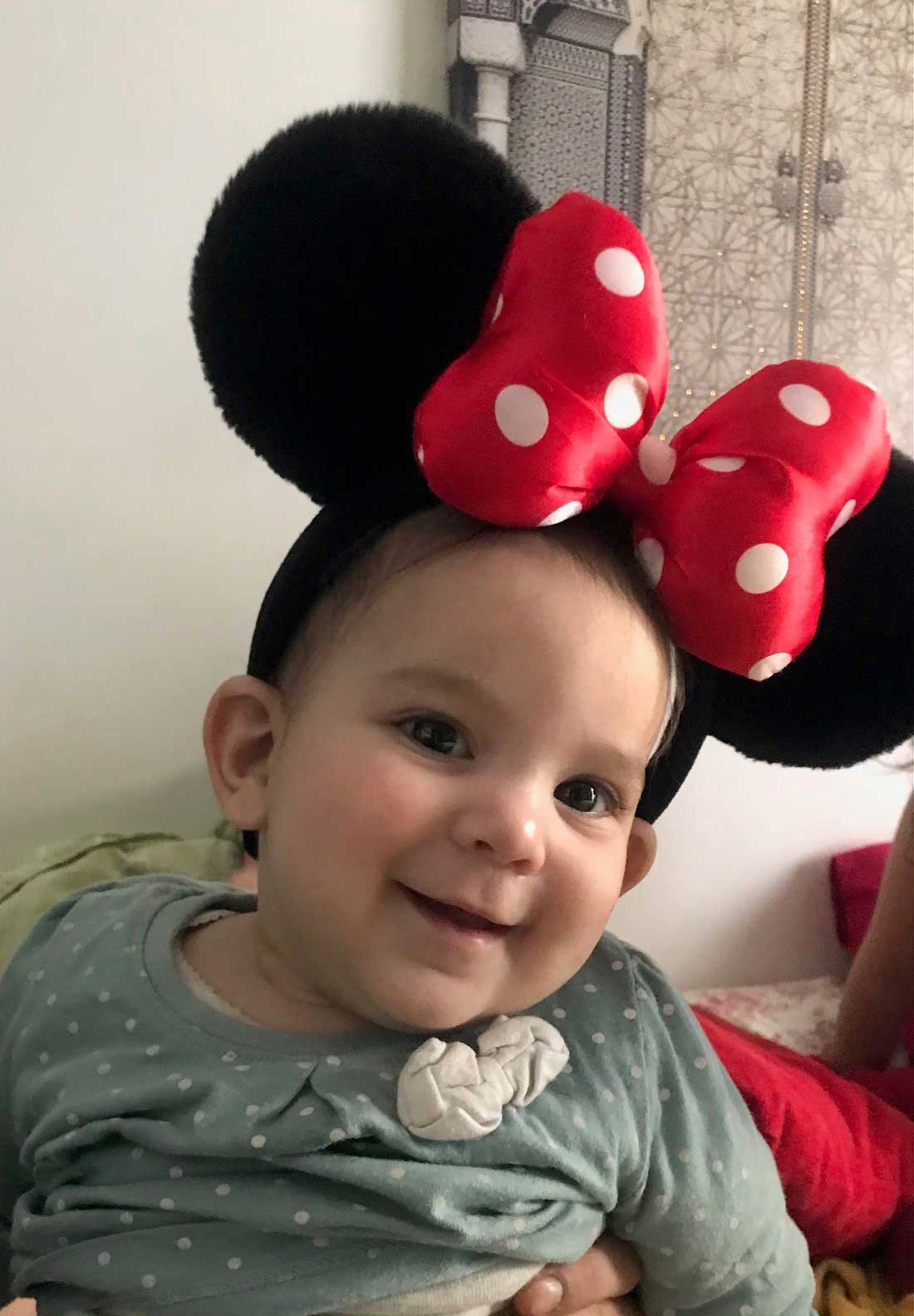 Baby girl in Minnie Mouse costume