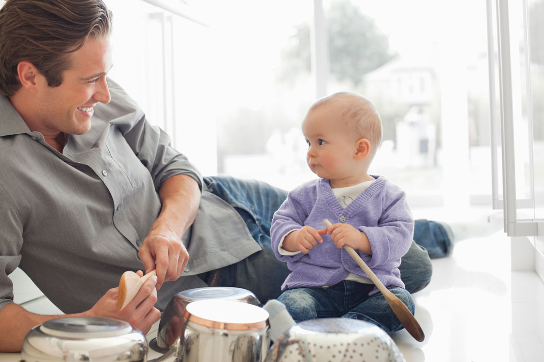 Dad and baby playing drums