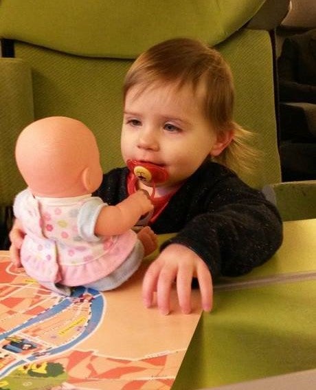 emilieemma baby playing with a doll