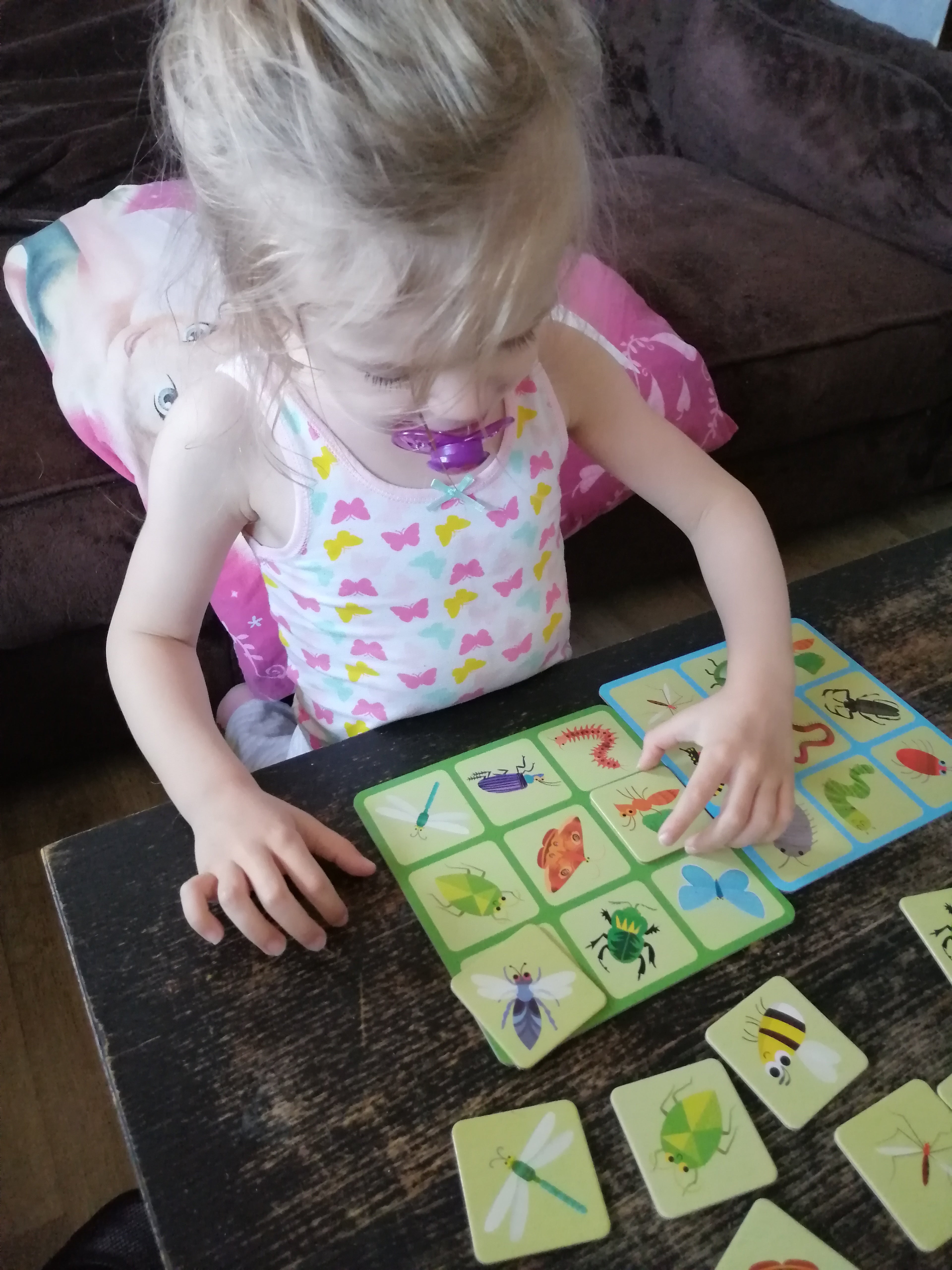 Little girl playing card game