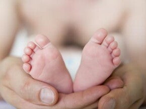Massaging baby's feet