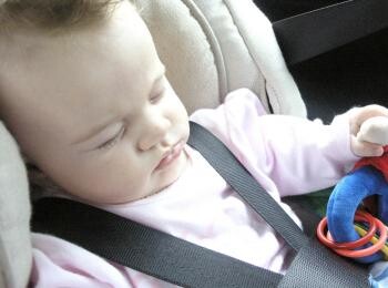 Baby sleeping in a car baby seat