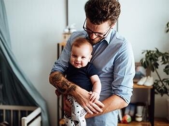 Dad holding his baby