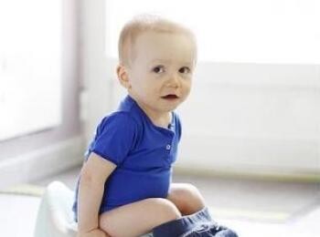 Baby using potty