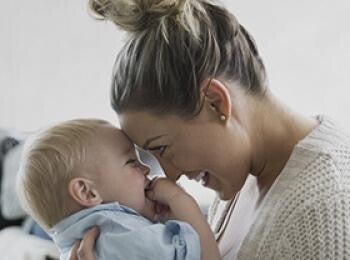 Mom and baby smiling at each other